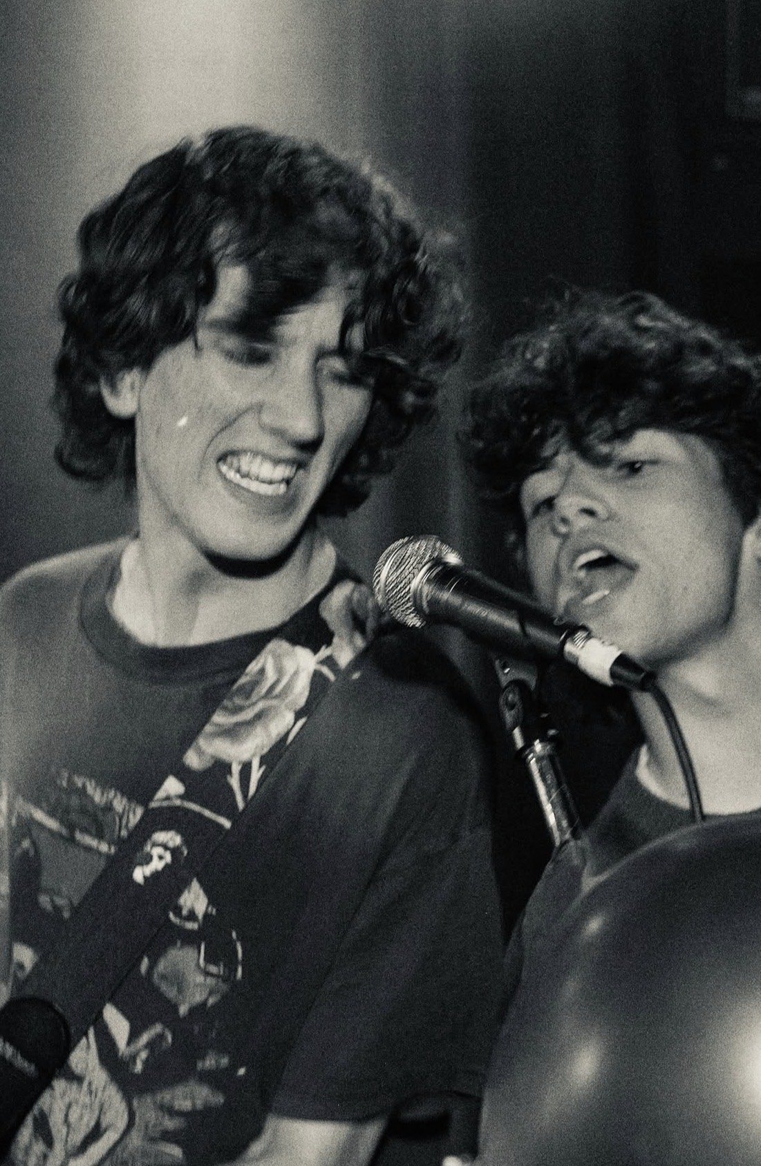 Nathan Ebbs and Cameron Cowie mid-song, black and white